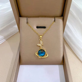 Celestial Elegance: Gold Planet & Moon Necklace