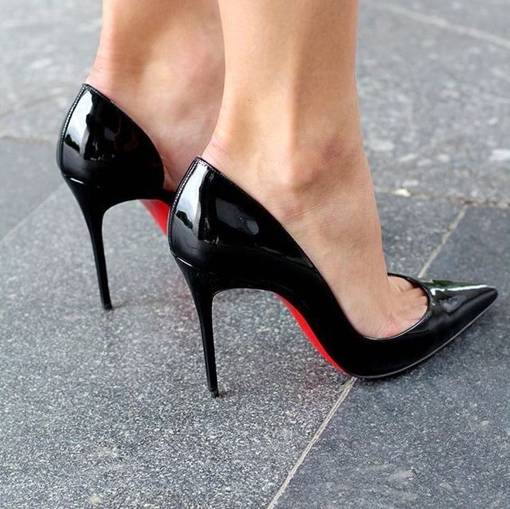 The Signature Stride: Obsidian Pumps with Crimson Soles